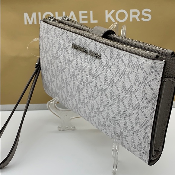 Michael Kors Handbags - MICHAEL KORS LG DOUBLE ZIP wristlet BRT WHITE